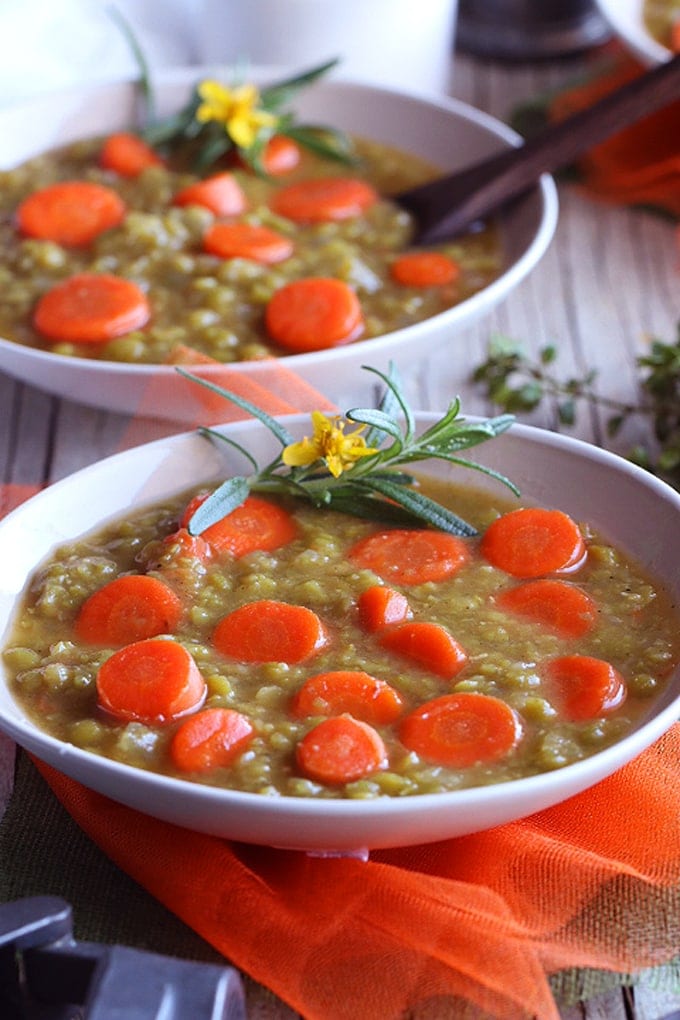 two bowls of split pea soup with yellow flowers