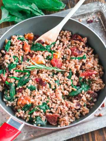 spinach and blood orange farro recipe on wooden table