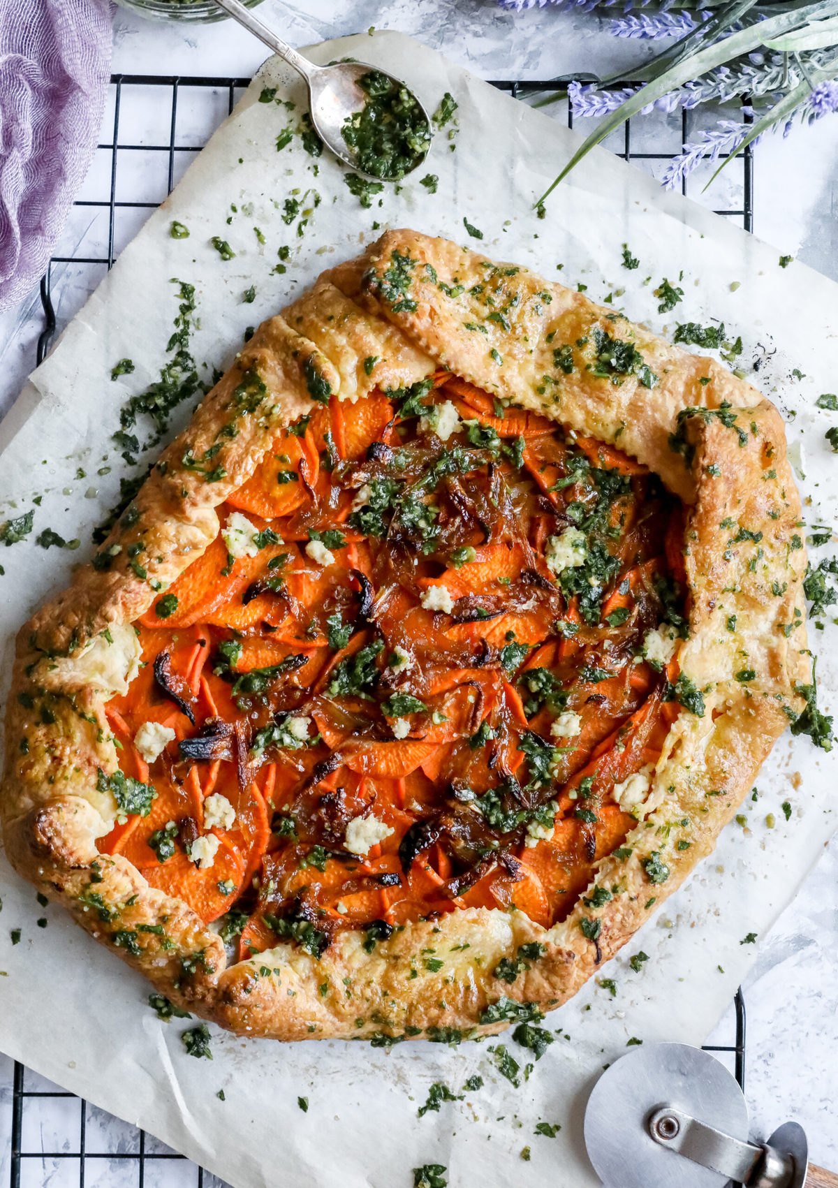 overhead shot of sweet potato galette with pepita gremolata on a cooking rack