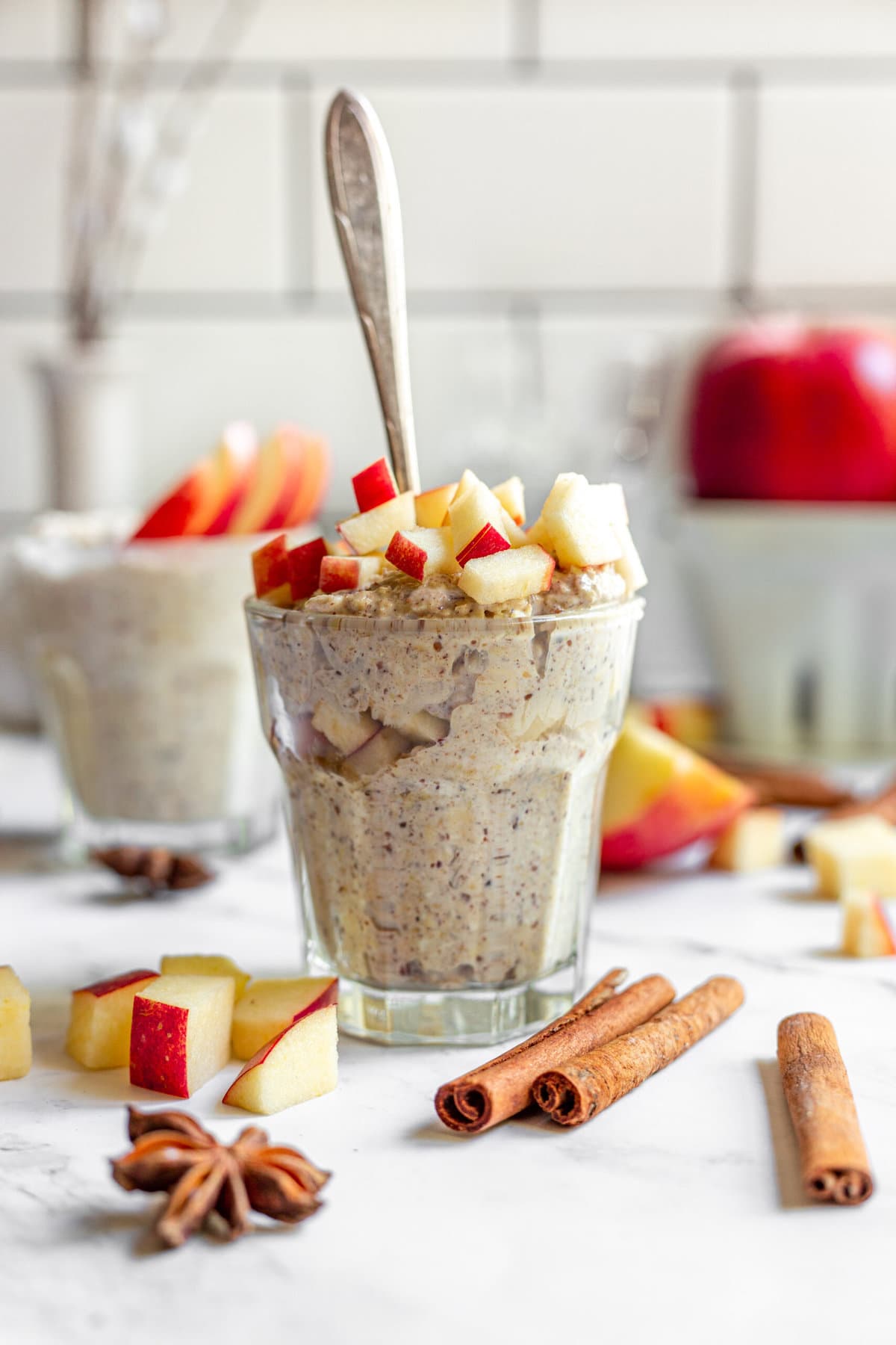 oats with apples in glasses on a white table